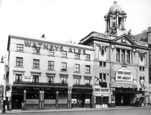 Photo:Victoria Palace Theatre, 126 Victoria Street, showing Off the record starring Eddie Calvert and Nat Jackley and the Duke of York Public House, 132-134 Victoria Street, 1954