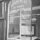 Photo:view of a shop selling horse meat in Harrow Road, 1953