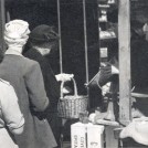 Photo:women shoppers queueing at a greengrocers in Harrow Road, c1955]